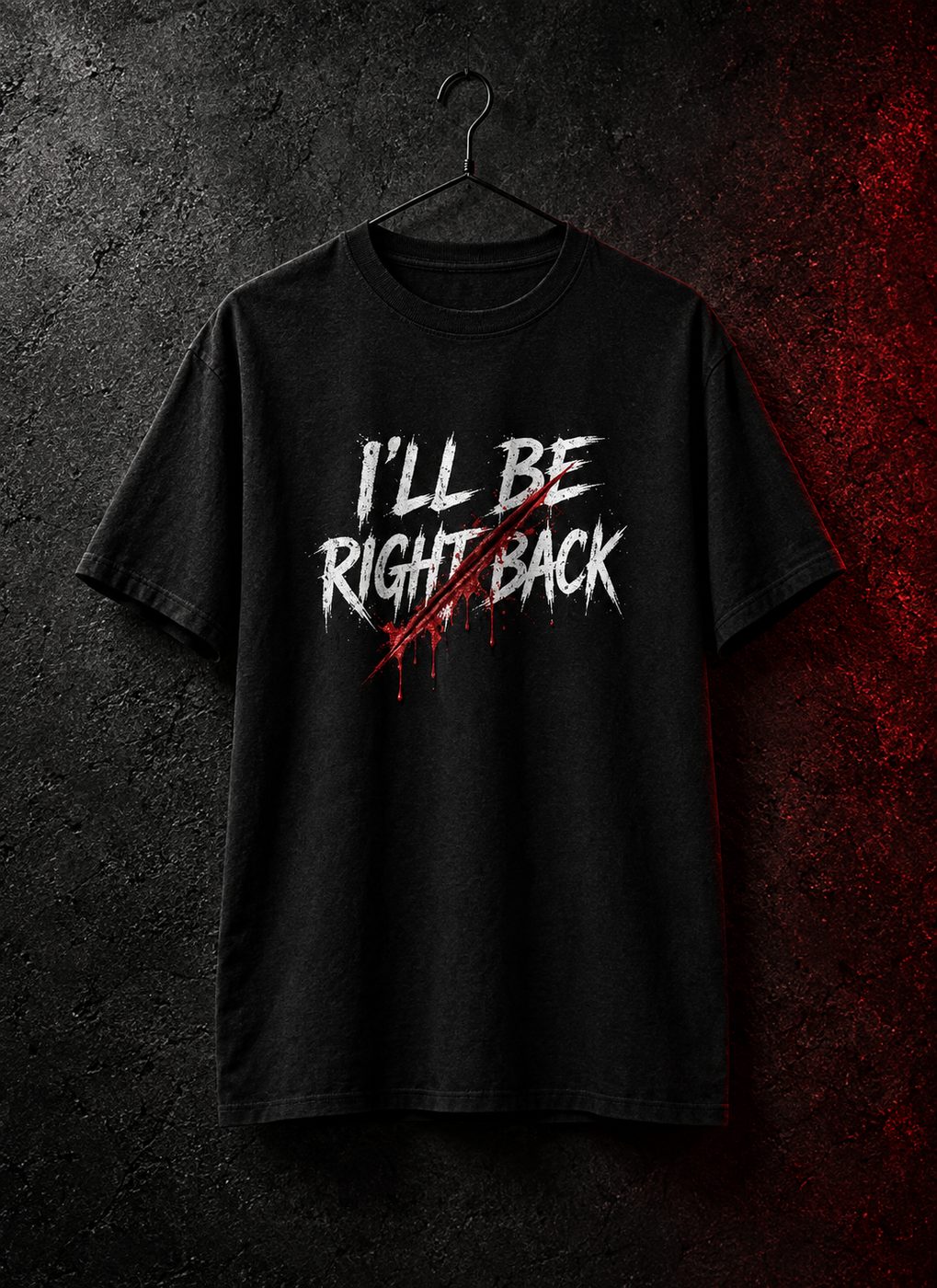 Front of the I'll Be Right Back tee on a hanger against dark concrete